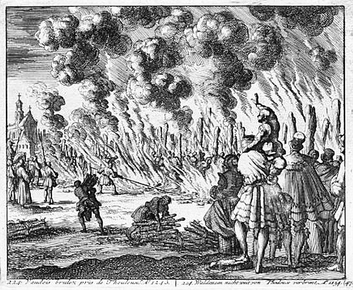 An old engraving showing people being burned at the stake