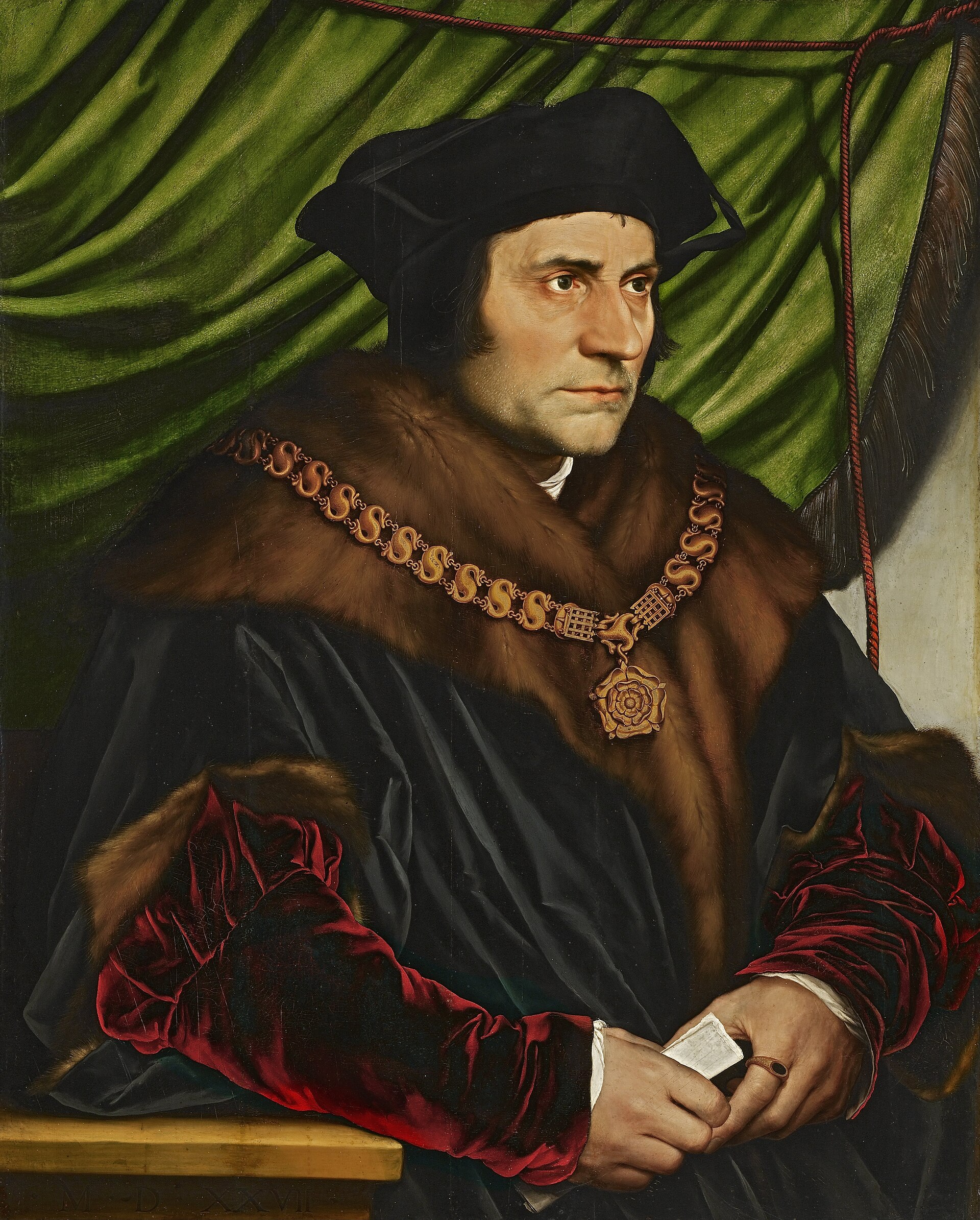 Half-length portrait of a man in a dark fur-trimmed robe with red velvet sleeves and a gold chain of office, seated against a green curtain