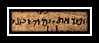 Close crop of brown papyrus with a line of dark Hebrew square-script letters