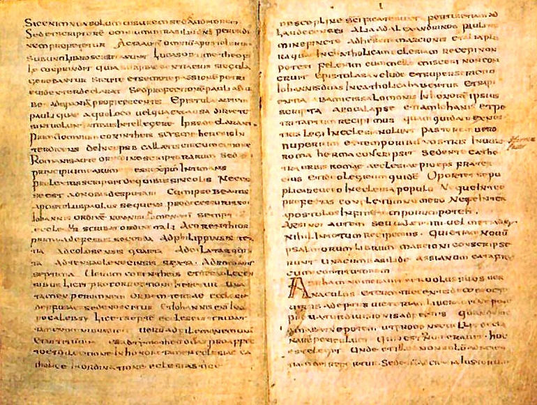 A page of faded Latin handwriting in brown ink on parchment, written in long lines without spaces between many of the words