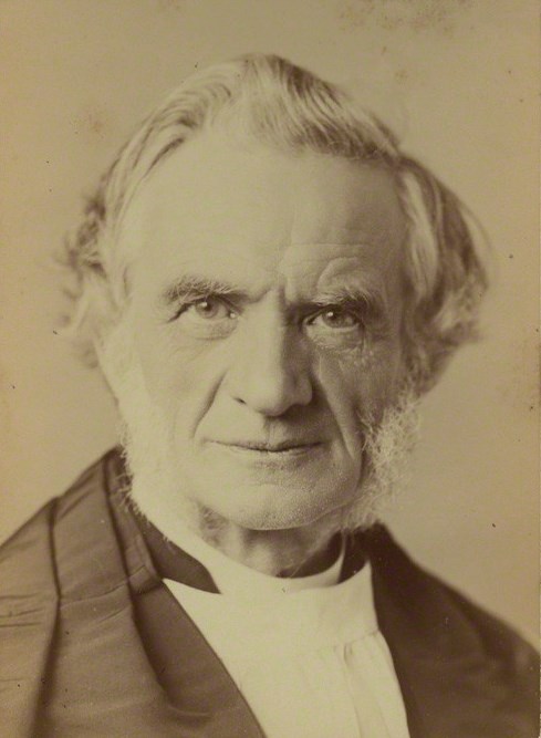 Head and shoulders photograph of an elderly bearded man in clerical dress with a high white collar