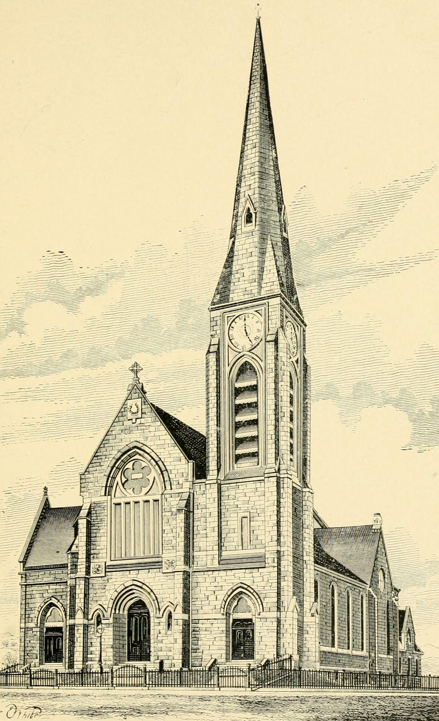 Black and white photograph of a tall stone church with a pointed spire and steep roof on a street corner, with trees in front
