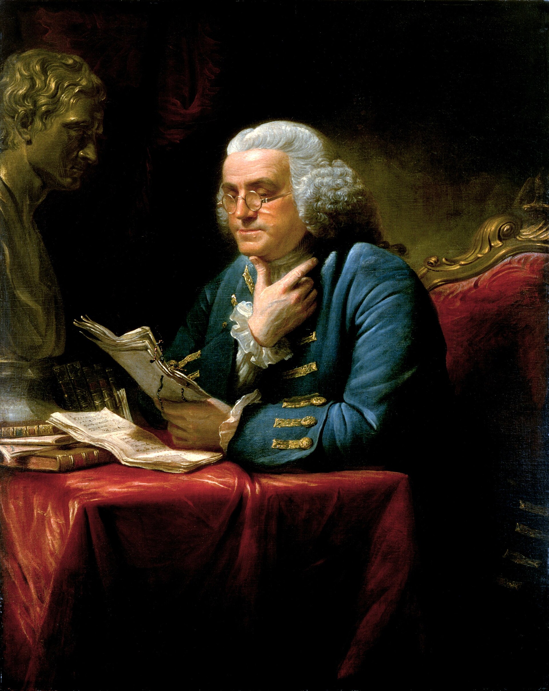 Oil portrait of an older man in a gray suit with a white cravat, seated at a desk reading a document, with a bust behind him