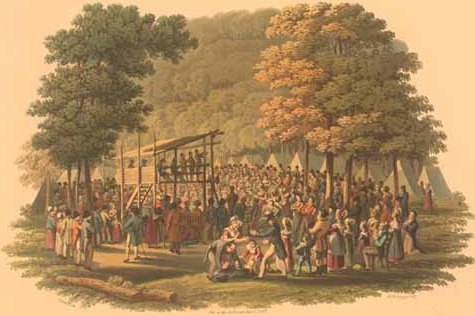 Small engraving of an outdoor meeting in a wooded clearing with a preacher's platform, tents and a large seated crowd