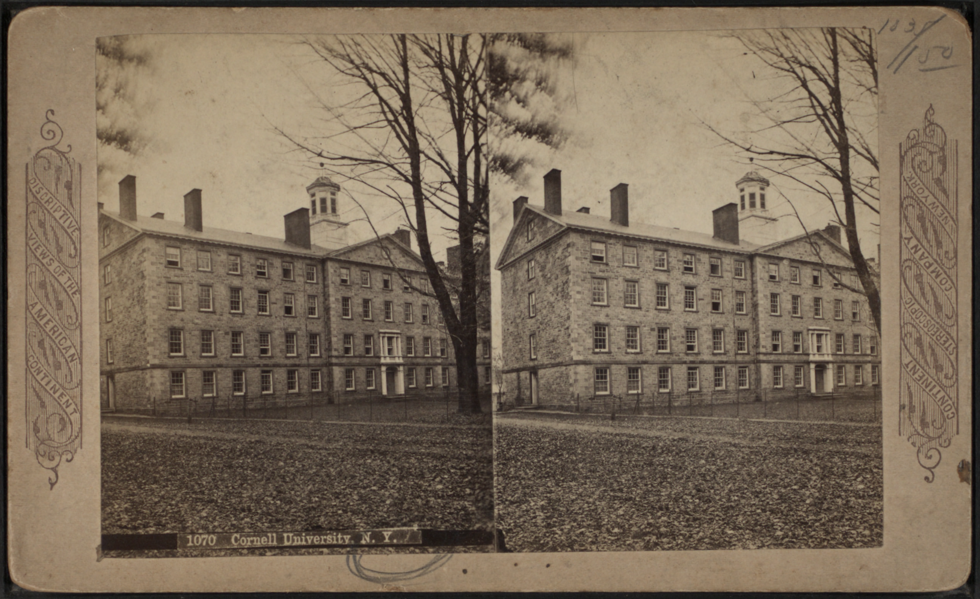 Old stereoscopic photograph, two nearly identical images side by side, of a long three-story stone building with a central cupola, trees in front