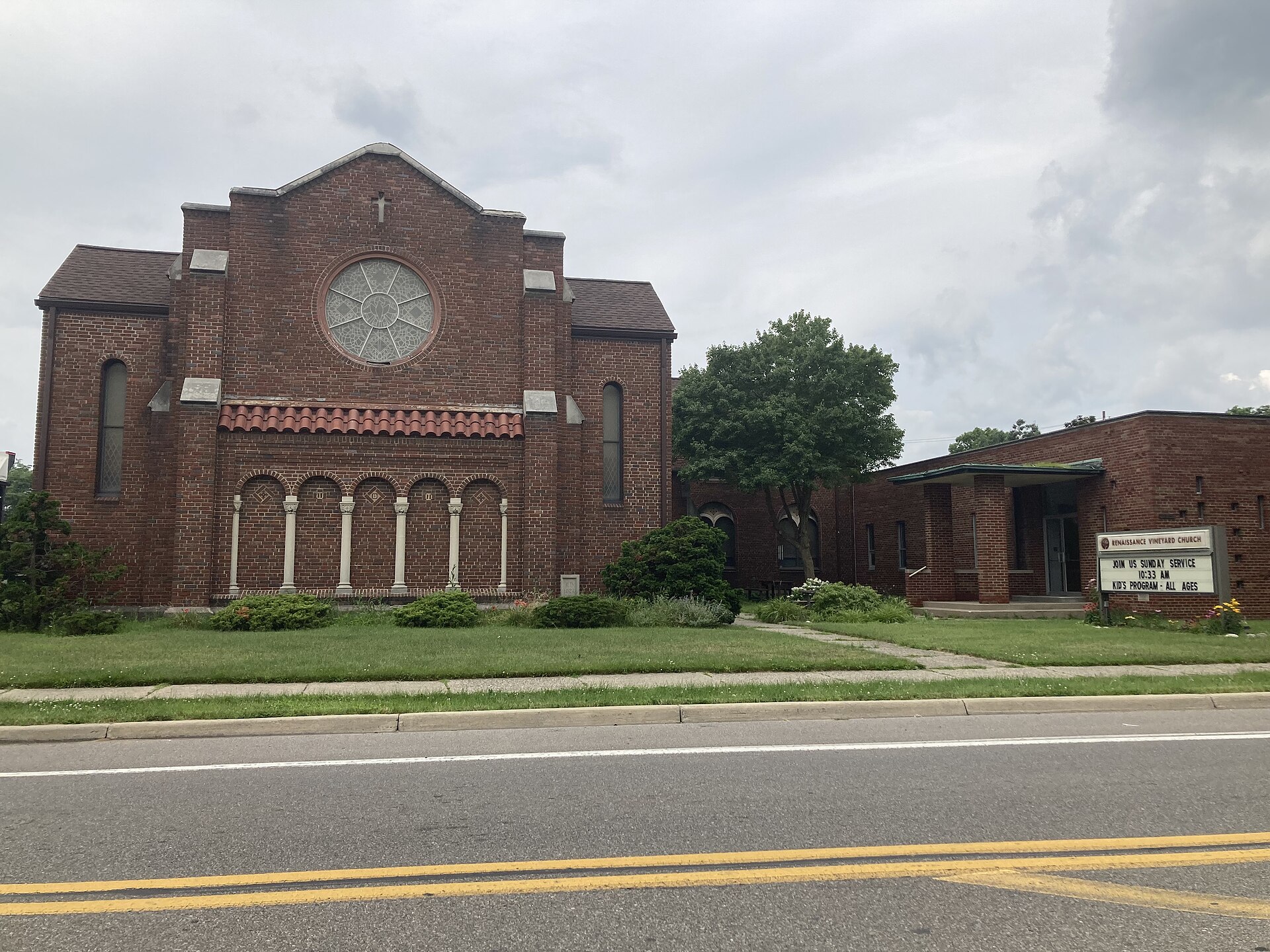 Exterior of the Renaissance Vineyard Church building in Ferndale, Michigan, seen from the street