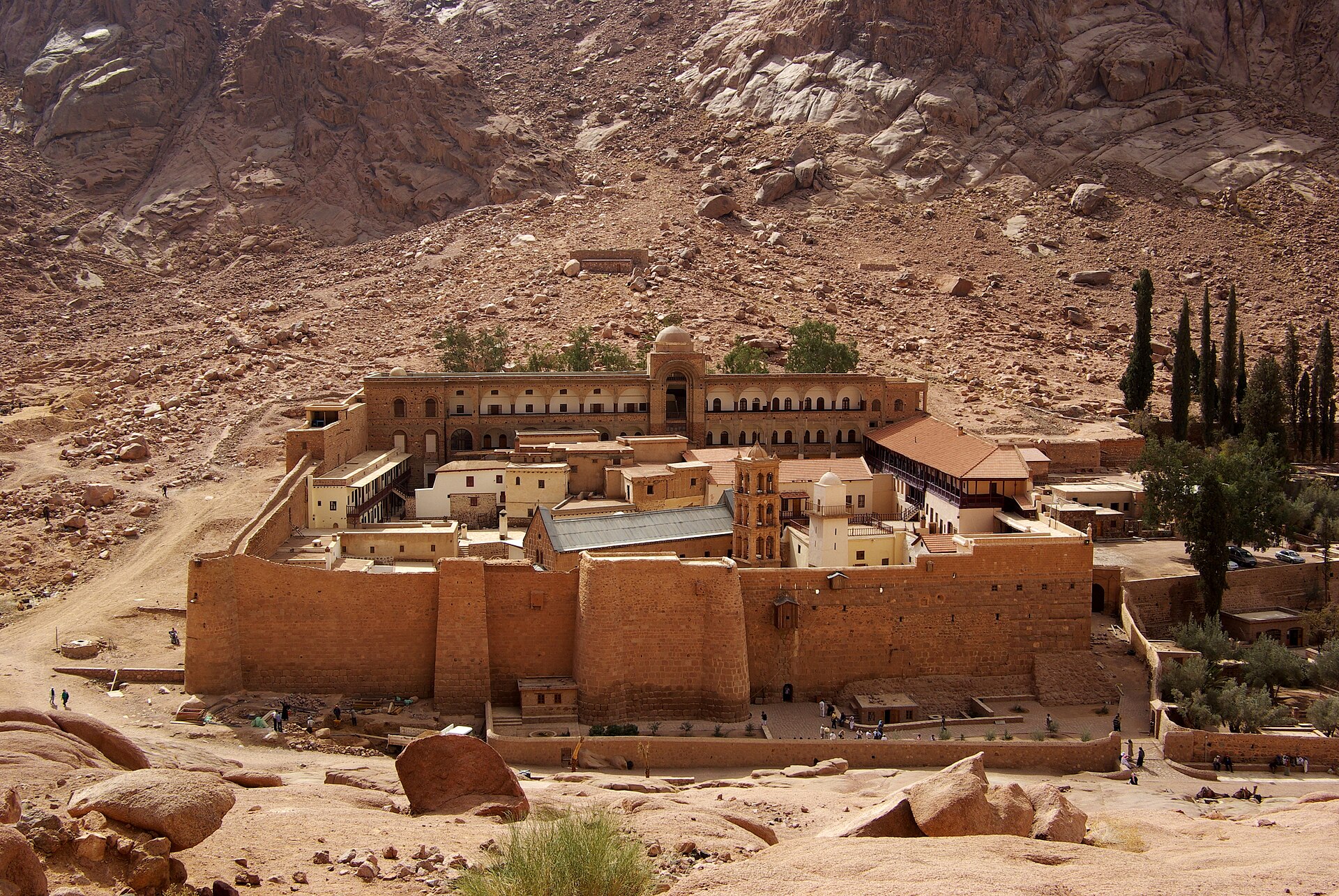 The walled Saint Catherine's Monastery below the mountains of Sinai