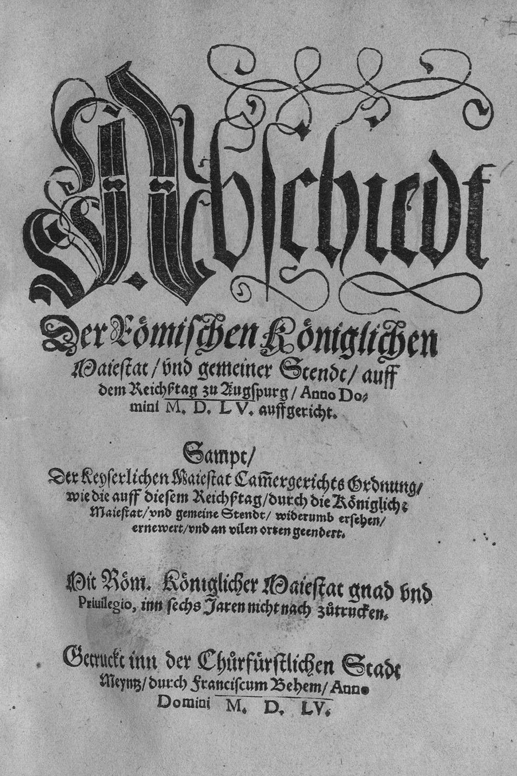 The title page of a sixteenth-century printed book with a large woodcut coat of arms of a double-headed eagle above blocks of German black-letter type