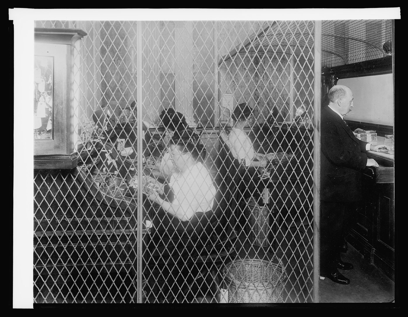 Money counters at work in the U.S. Treasury cash room in 1914, checking and sorting the day's deposits