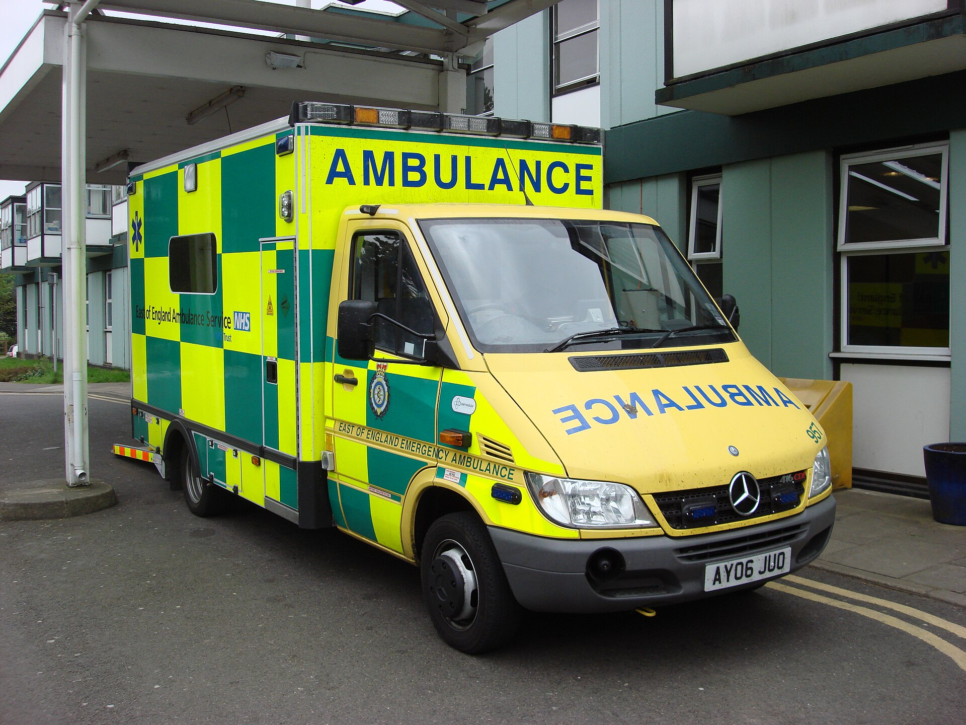 An East of England emergency ambulance parked at West Suffolk Hospital, with the word AMBULANCE in mirror writing on the front