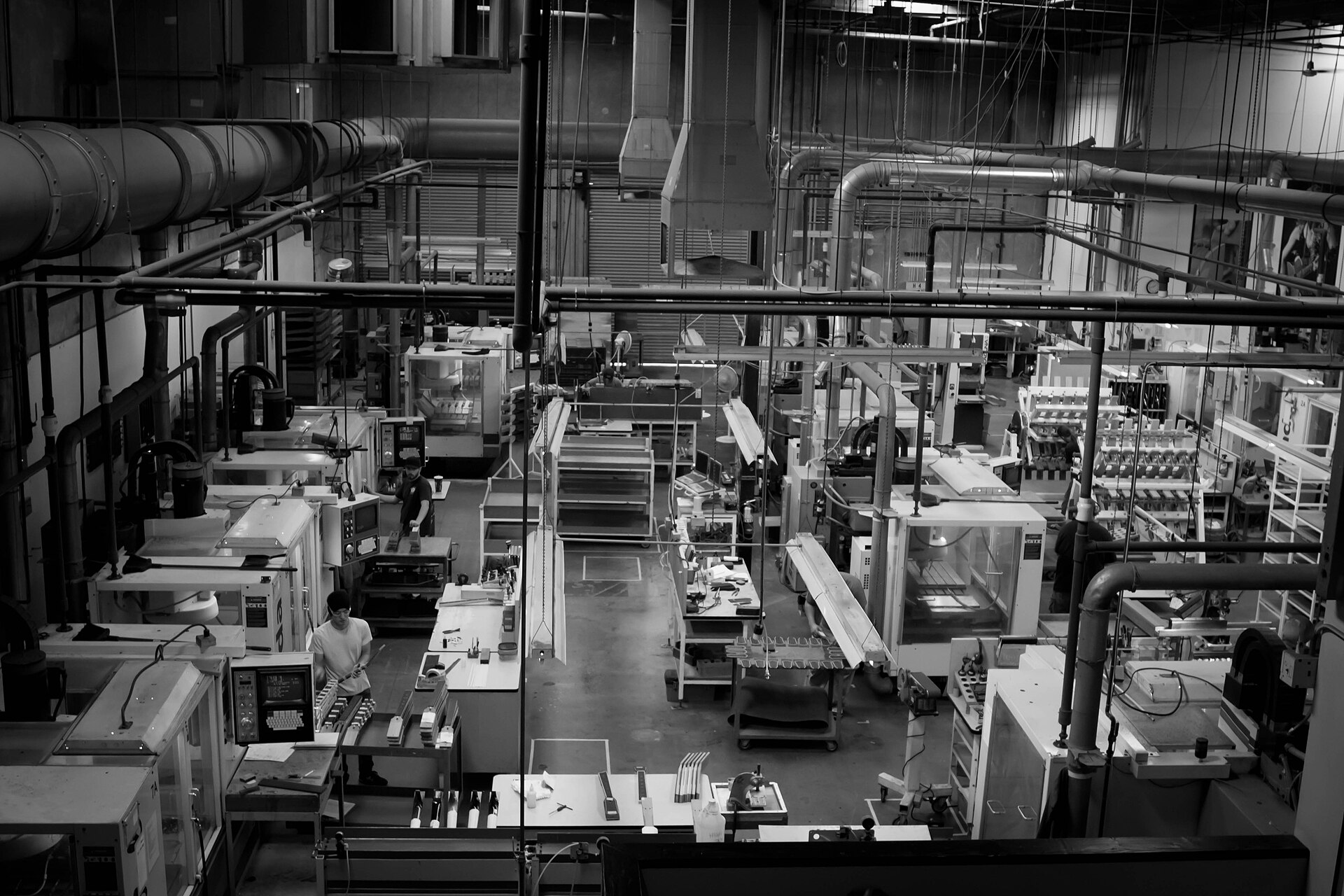 Computer-controlled (CNC) milling machines used to cut guitar necks, on the production floor of the Taylor Guitars factory.