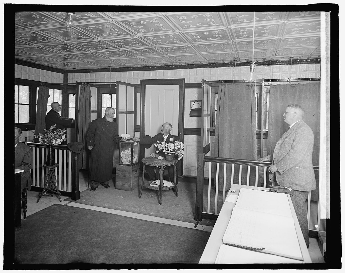 A small wooden building used as a polling place in 1924, with a voting booth visible