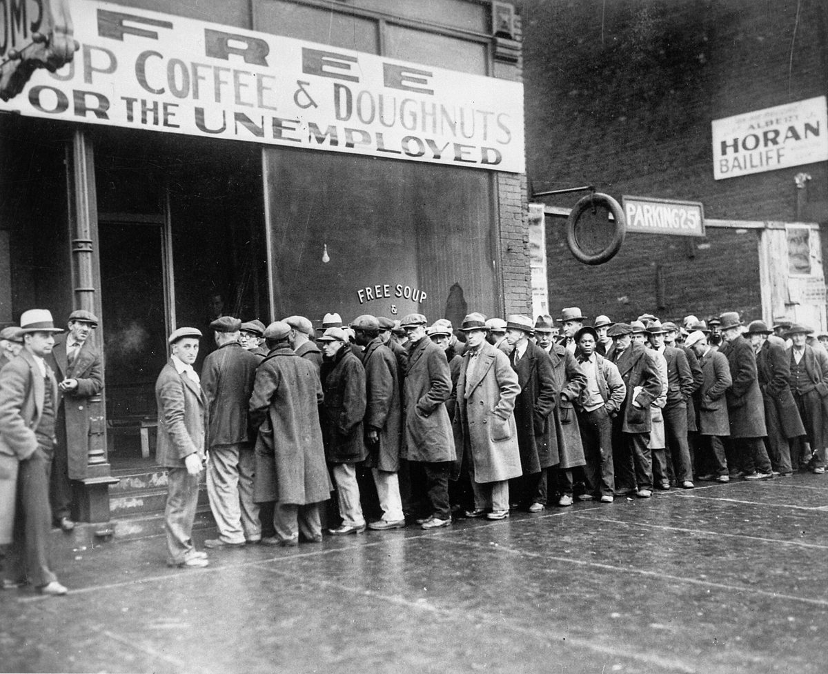 A long line of unemployed men standing in the street outside a soup kitchen in Chicago in February 1931