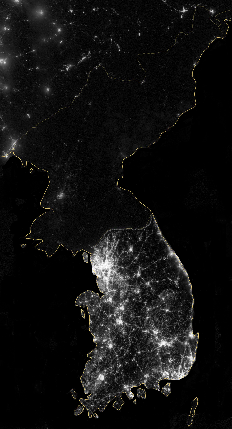 Satellite composite of the Korean Peninsula at night, with South Korea brightly lit and North Korea almost entirely dark