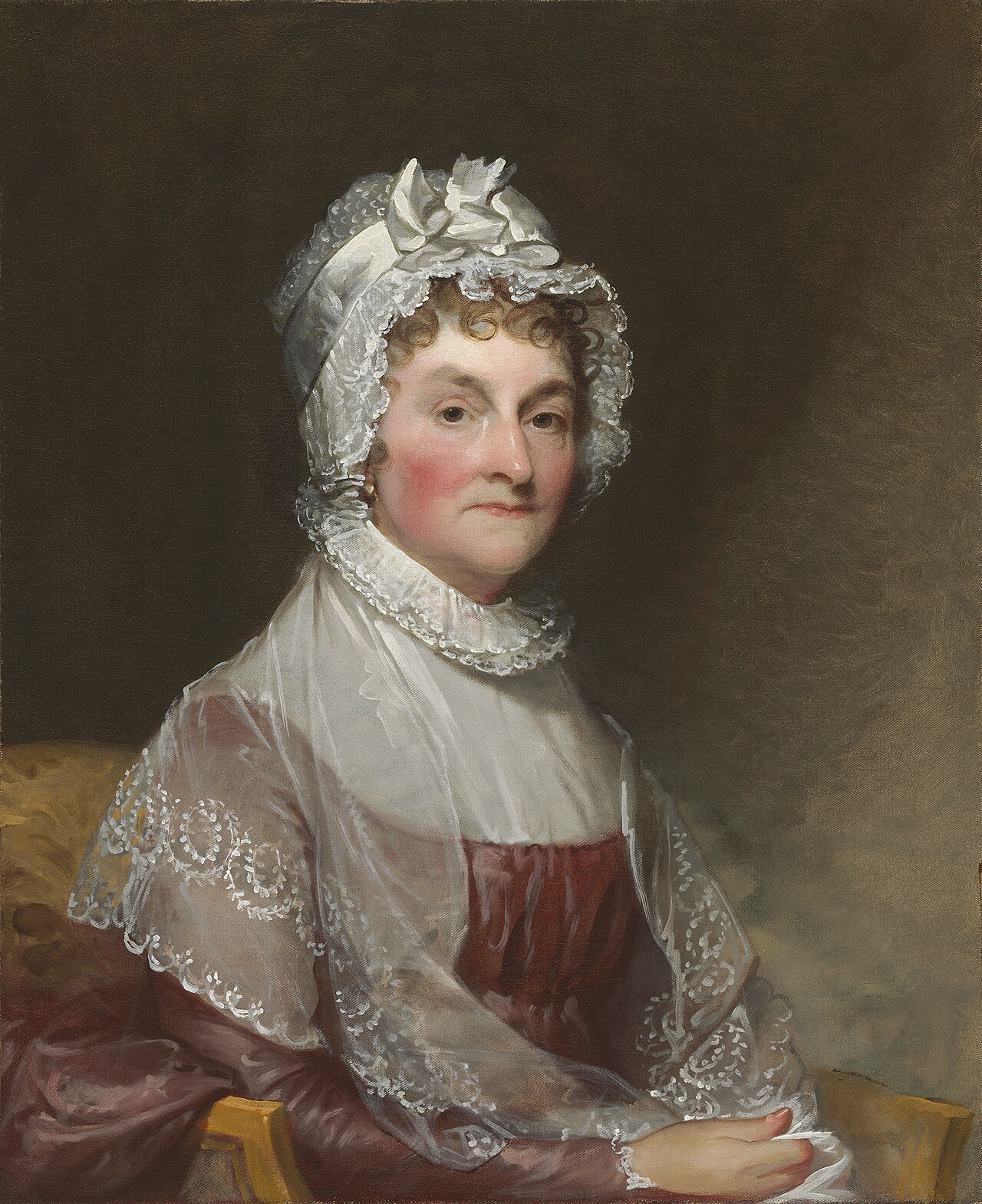 Painted portrait of Abigail Adams in a white cap and shawl, seated and looking calmly out of the canvas