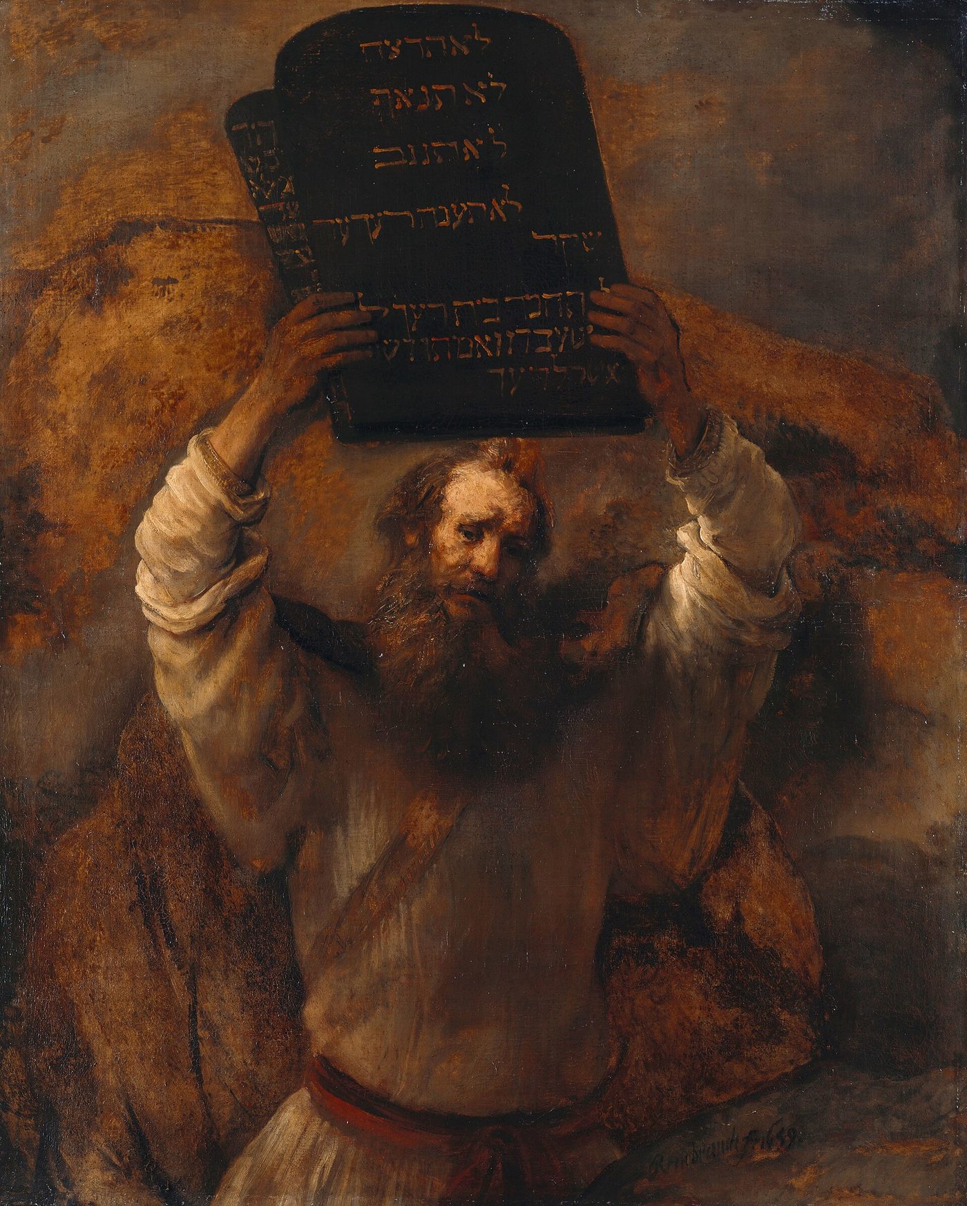Moses holding up the two stone tablets of the law above his head against a dark background