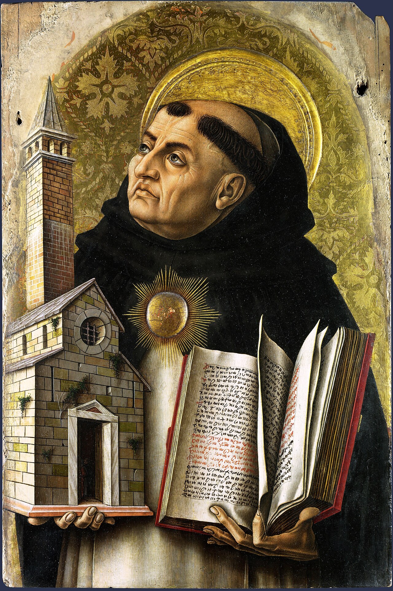 Painted panel of the saint Thomas Aquinas in a Dominican habit holding a book, against a gold background