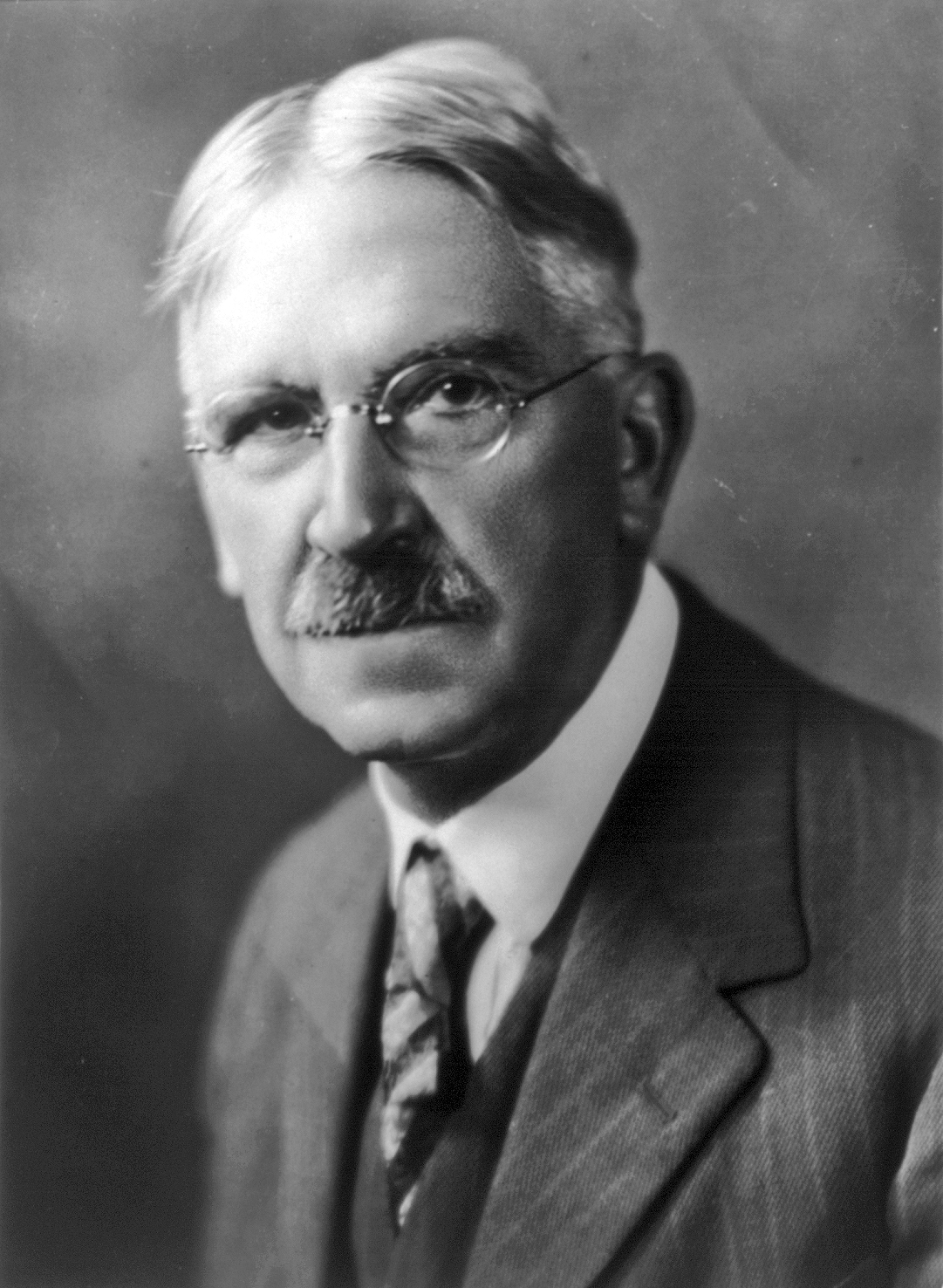 Bust portrait photograph of the philosopher John Dewey