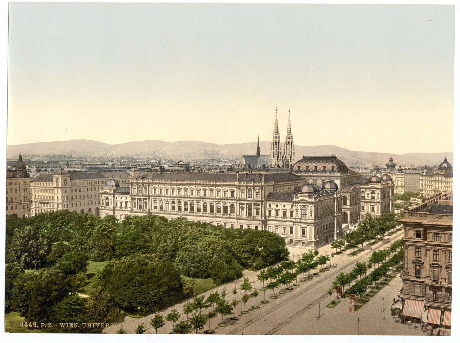 Color photochrom view of the main building of the University of Vienna on the Ringstrasse, with a broad facade, a central portico and trees in front