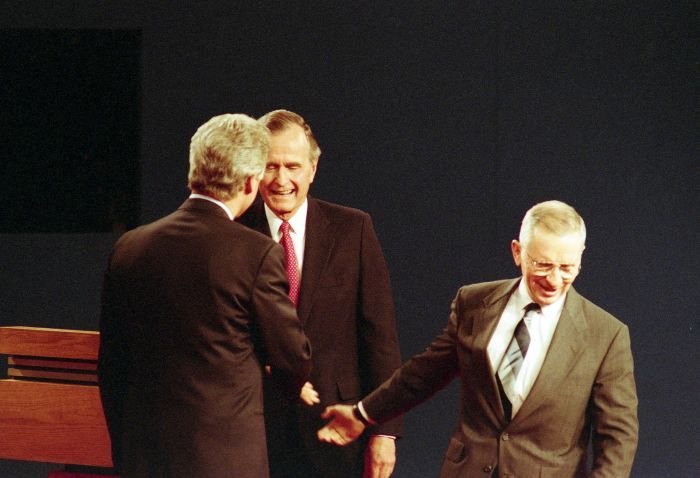 President Bush taking part in the third presidential debate with Bill Clinton and Ross Perot at Michigan State University, with moderator Jim Lehrer