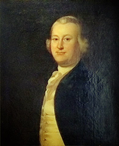 Painted portrait of James Otis Jr. as a young man with powdered hair, wearing a dark blue coat over a cream waistcoat and a white cravat, against a dark background