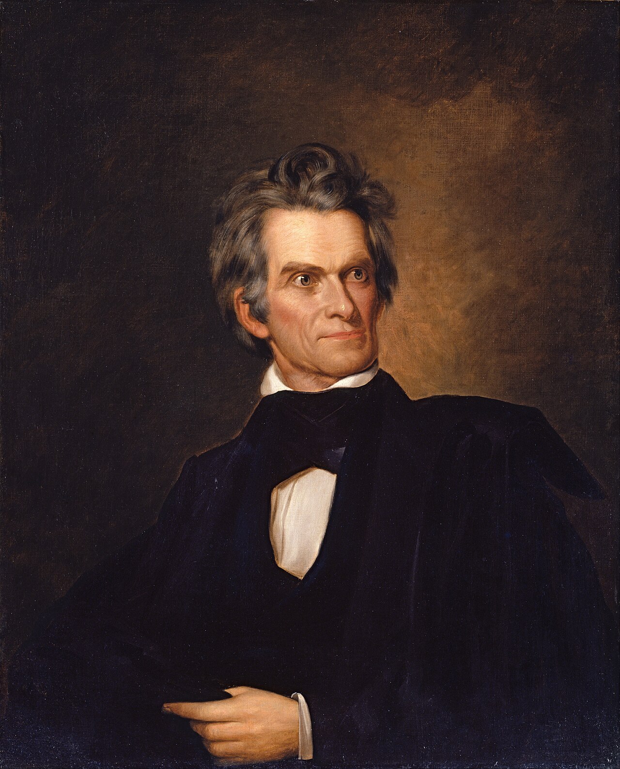 An oil portrait of John C. Calhoun with swept-back gray hair, dark coat and white collar