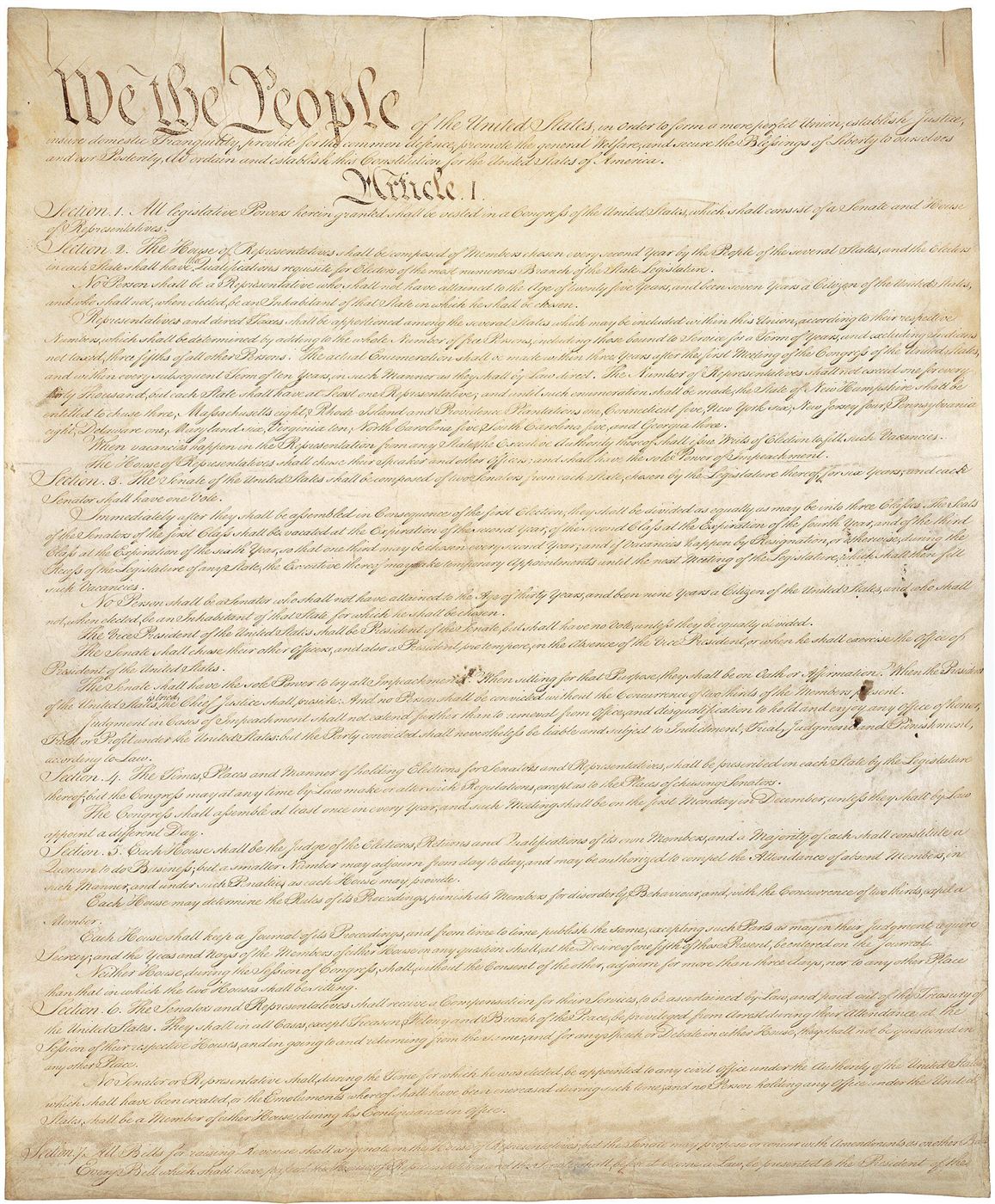 The first page of the handwritten United States Constitution, beginning with the words We the People in large script